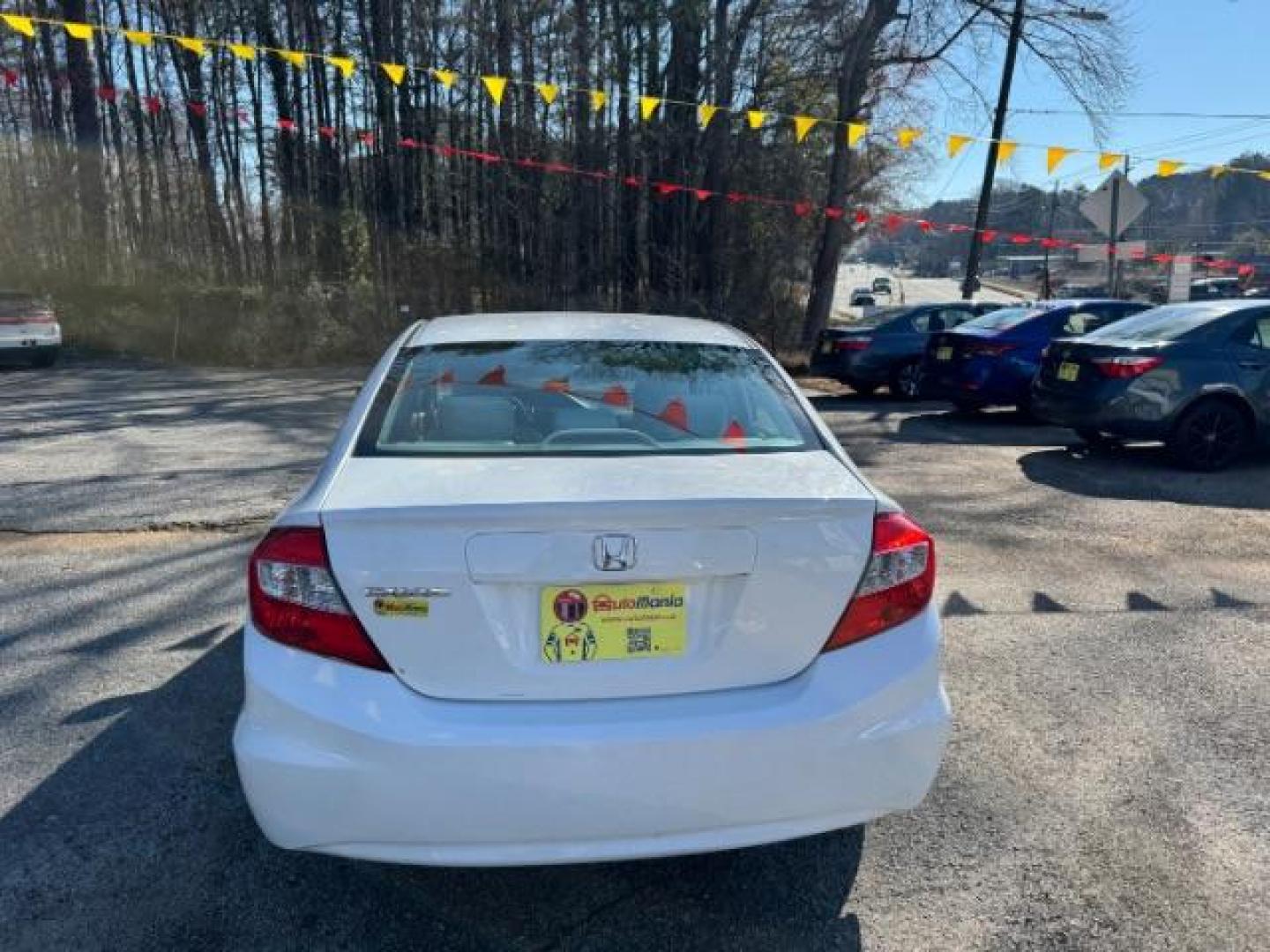 2012 White Honda Civic LX (2HGFB2F59CH) with an 1.8L I-4 MPI SOHC engine, located at 1806 Veterans Memorial Hwy SW, Austell, GA, 30168, (770) 944-9558, 33.817959, -84.606987 - Photo#4