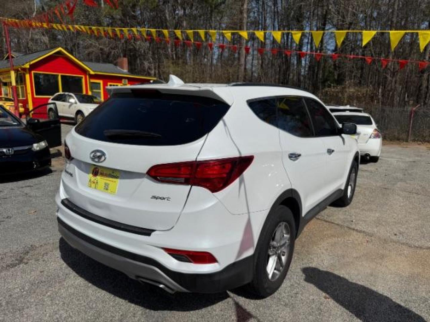 2017 White Hyundai Santa Fe Sport BASE (5NMZU3LB1HH) with an 2.4L I-4 DI DOHC engine, located at 1806 Veterans Memorial Hwy SW, Austell, GA, 30168, (770) 944-9558, 33.817959, -84.606987 - Photo#2
