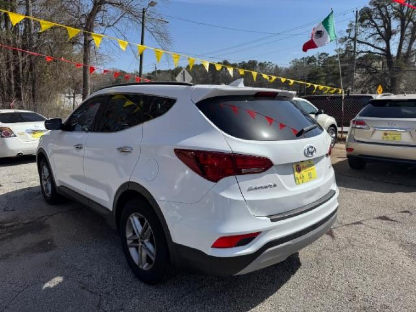 2017 White Hyundai Santa Fe Sport BASE (5NMZU3LB1HH) with an 2.4L I-4 DI DOHC engine, located at 1806 Veterans Memorial Hwy SW, Austell, GA, 30168, (770) 944-9558, 33.817959, -84.606987 - Photo#5