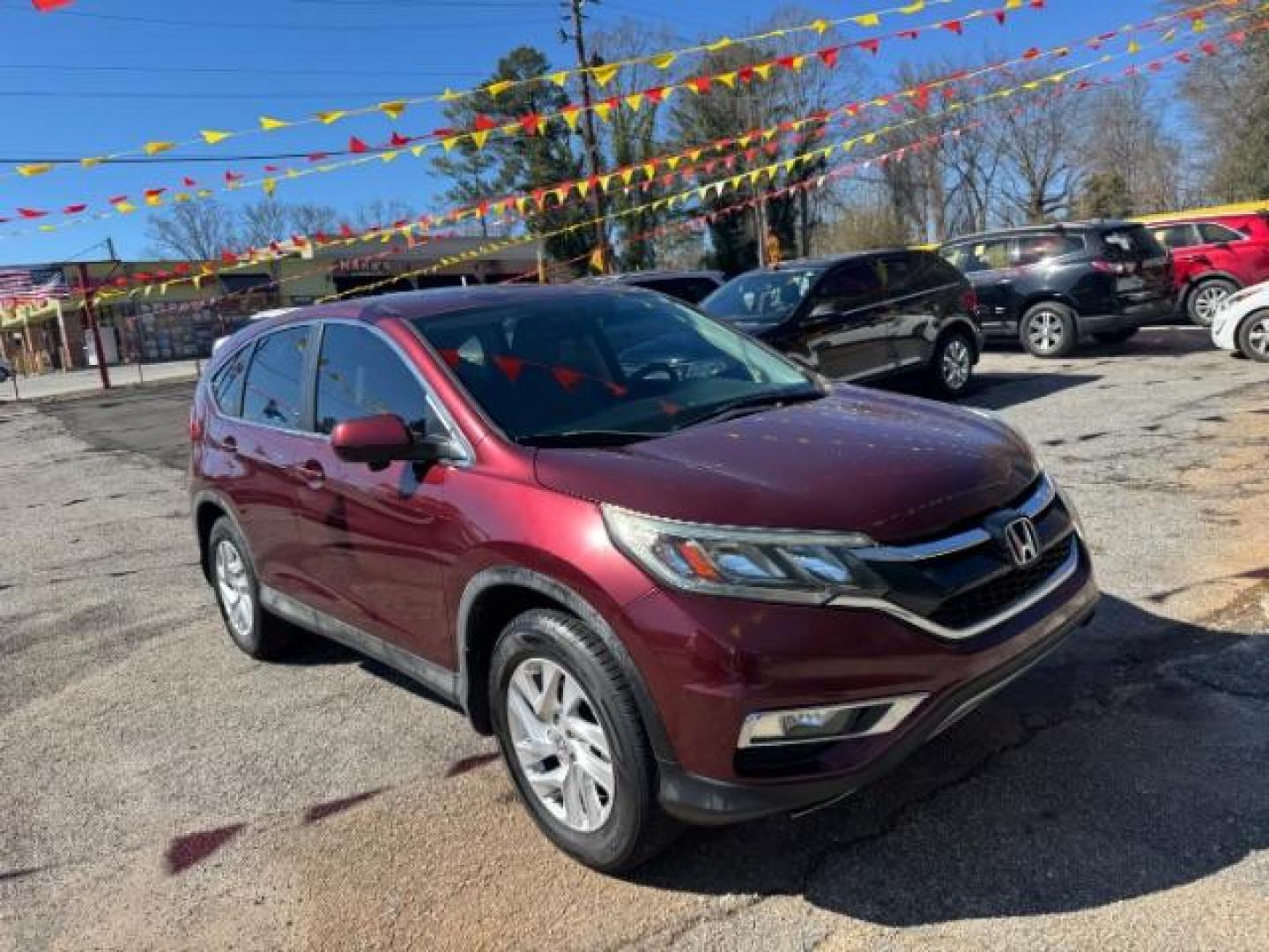 2015 Maroon Honda CR-V EX (2HKRM3H58FH) with an 2.4L I-4 MPI DOHC engine, located at 1806 Veterans Memorial Hwy SW, Austell, GA, 30168, (770) 944-9558, 33.817959, -84.606987 - Photo#2