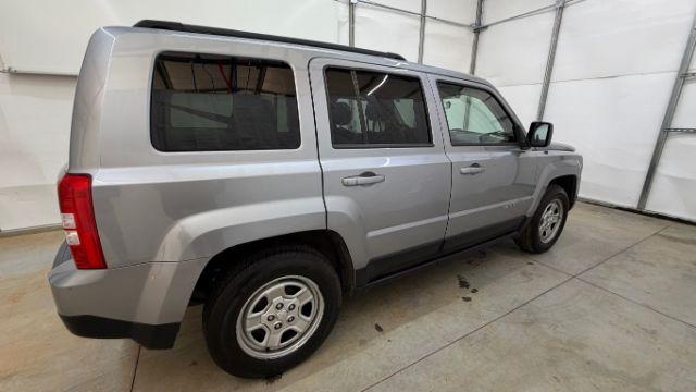 2015 Silver Jeep Patriot Sport (1C4NJPBAXFD) with an 2.0L I-4 SFI DOHC engine, located at 1806 Veterans Memorial Hwy SW, Austell, GA, 30168, (770) 944-9558, 33.817959, -84.606987 - Photo#6