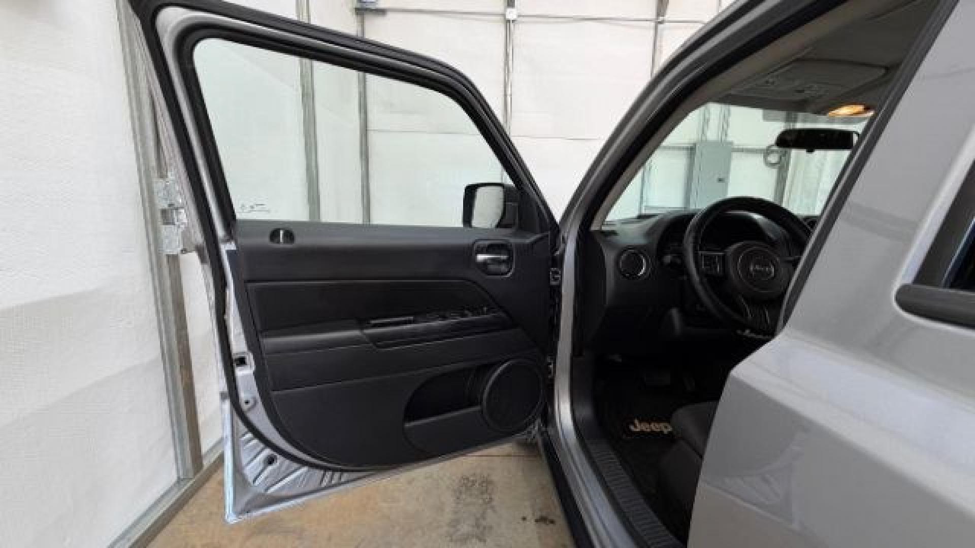 2015 Silver Jeep Patriot Sport (1C4NJPBAXFD) with an 2.0L I-4 SFI DOHC engine, located at 1806 Veterans Memorial Hwy SW, Austell, GA, 30168, (770) 944-9558, 33.817959, -84.606987 - Photo#10