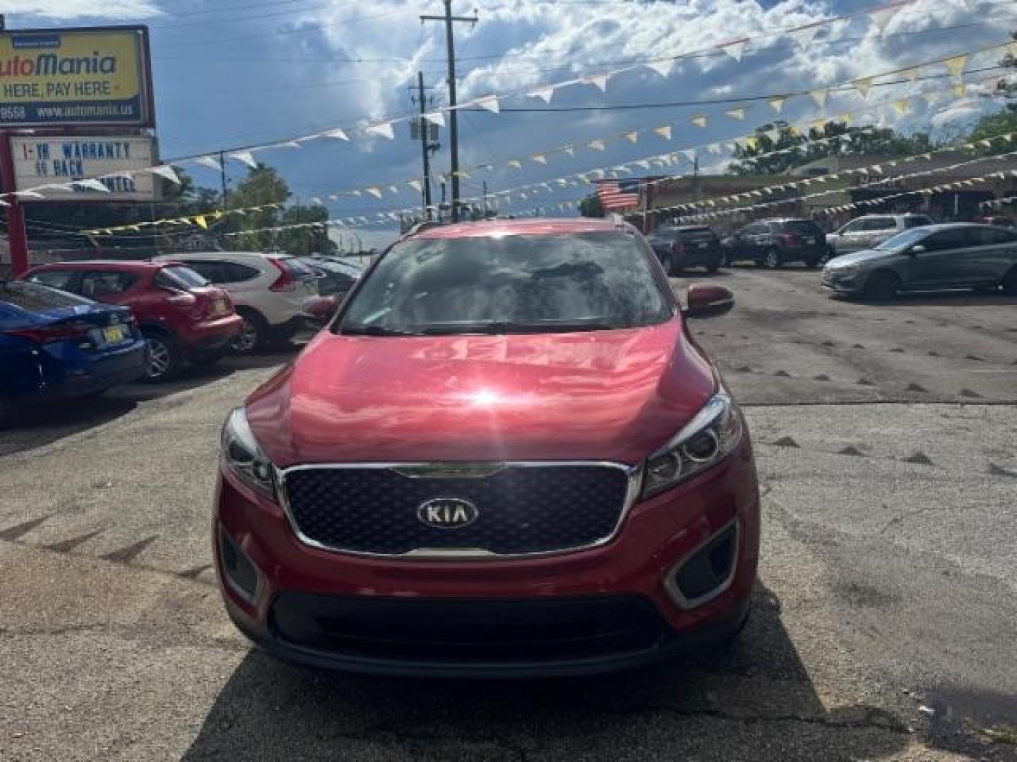 2017 Red Kia Sorento 3.3L LX (5XYPG4A51HG) with an Lambda II 3.3L V-6 gasoline direct injection engine, located at 1806 Veterans Memorial Hwy SW, Austell, GA, 30168, (770) 944-9558, 33.817959, -84.606987 - Photo#1