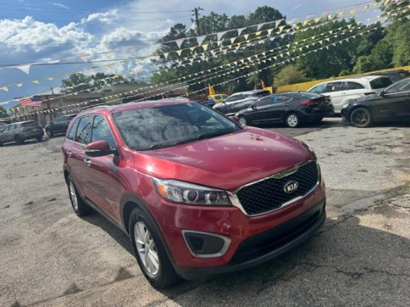 2017 Red Kia Sorento 3.3L LX (5XYPG4A51HG) with an Lambda II 3.3L V-6 gasoline direct injection engine, located at 1806 Veterans Memorial Hwy SW, Austell, GA, 30168, (770) 944-9558, 33.817959, -84.606987 - Photo#2