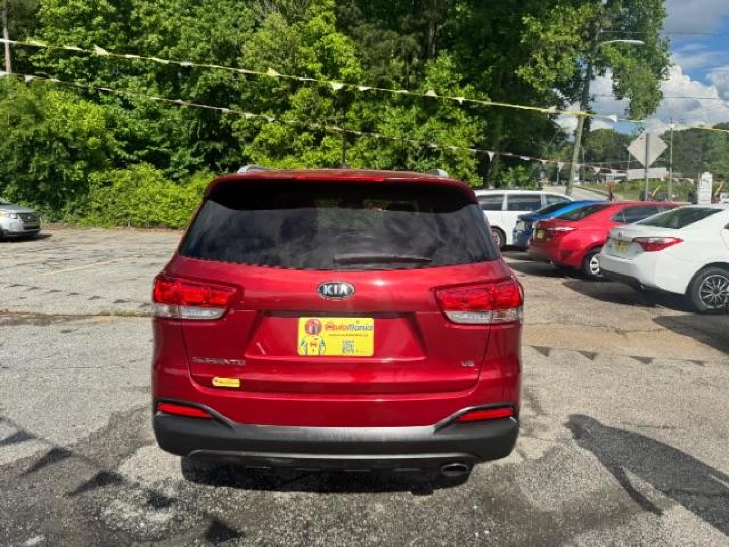 2017 Red Kia Sorento 3.3L LX (5XYPG4A51HG) with an Lambda II 3.3L V-6 gasoline direct injection engine, located at 1806 Veterans Memorial Hwy SW, Austell, GA, 30168, (770) 944-9558, 33.817959, -84.606987 - Photo#4