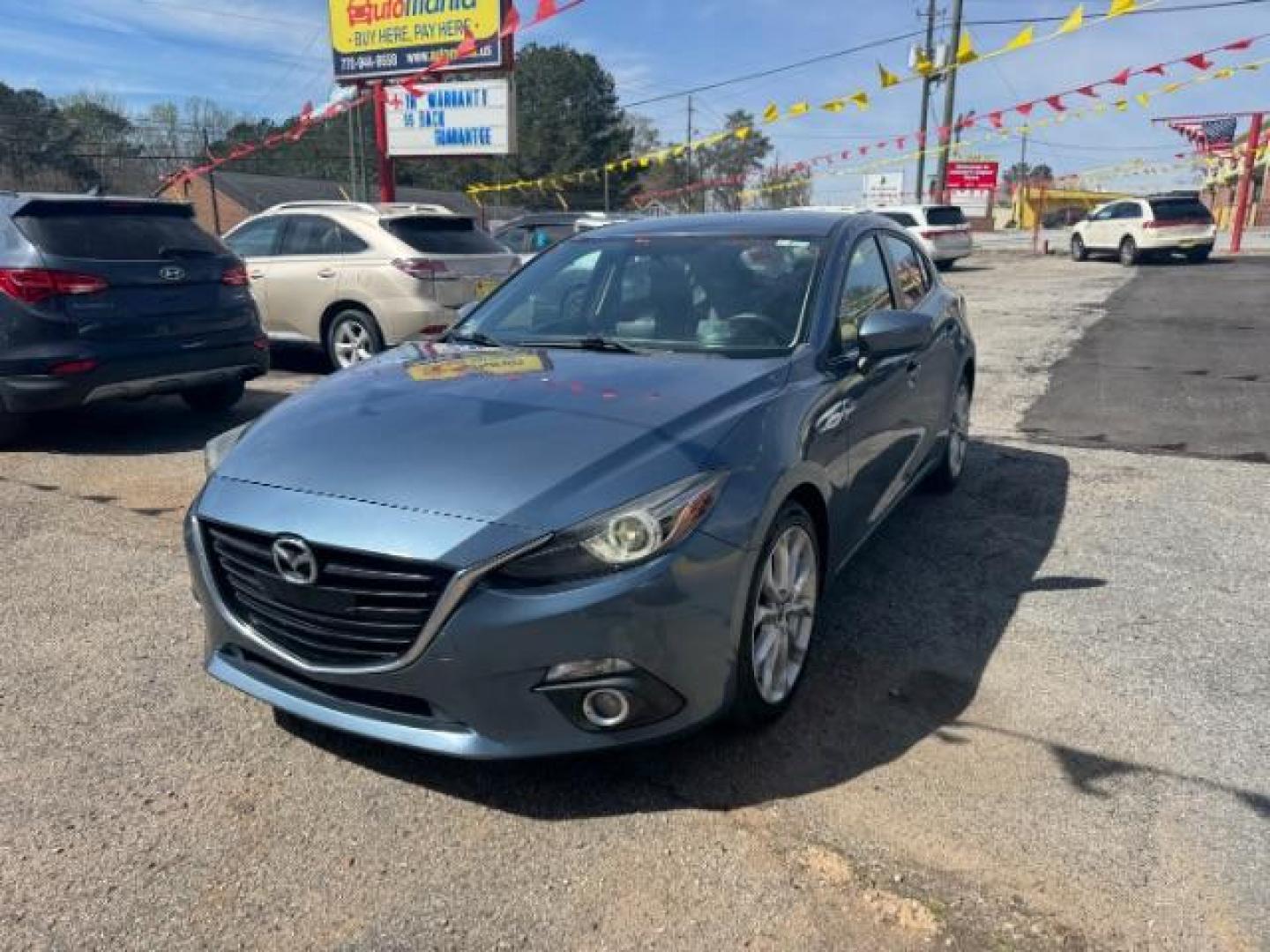 2014 Blue Mazda Mazda3 Hatchback s Touring (JM1BM1L3XE1) with an SKYACTIV-G 2.5L I-4 gasoline direct injection engine, located at 1806 Veterans Memorial Hwy SW, Austell, GA, 30168, (770) 944-9558, 33.817959, -84.606987 - Photo#0