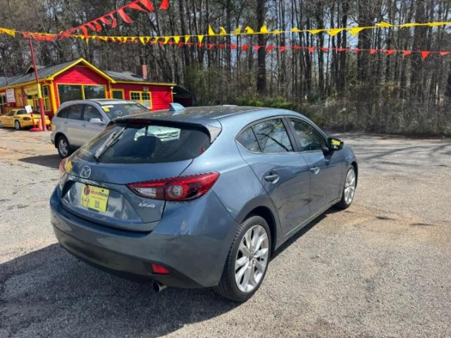 2014 Blue Mazda Mazda3 Hatchback s Touring (JM1BM1L3XE1) with an SKYACTIV-G 2.5L I-4 gasoline direct injection engine, located at 1806 Veterans Memorial Hwy SW, Austell, GA, 30168, (770) 944-9558, 33.817959, -84.606987 - Photo#1