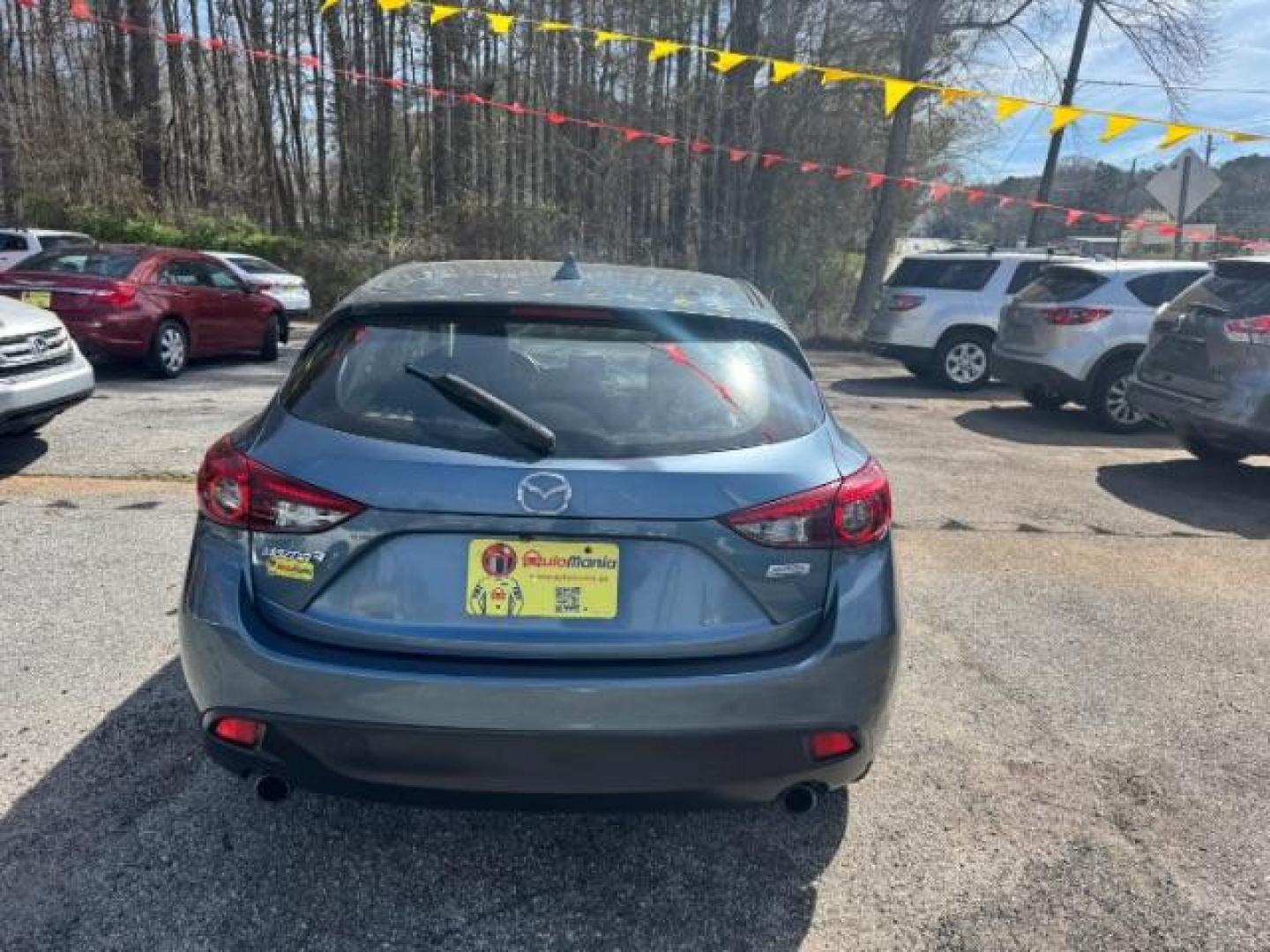 2014 Blue Mazda Mazda3 Hatchback s Touring (JM1BM1L3XE1) with an SKYACTIV-G 2.5L I-4 gasoline direct injection engine, located at 1806 Veterans Memorial Hwy SW, Austell, GA, 30168, (770) 944-9558, 33.817959, -84.606987 - Photo#3