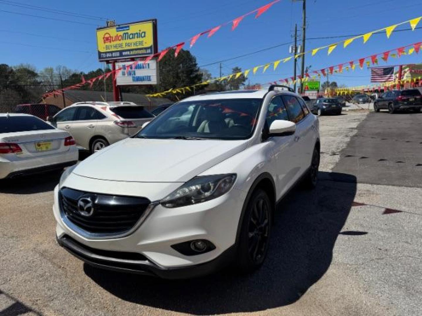 2014 White Mazda CX-9 Grand Touring (JM3TB2DA8E0) with an 3.7L V-6 DOHC engine, located at 1806 Veterans Memorial Hwy SW, Austell, GA, 30168, (770) 944-9558, 33.817959, -84.606987 - Photo#0