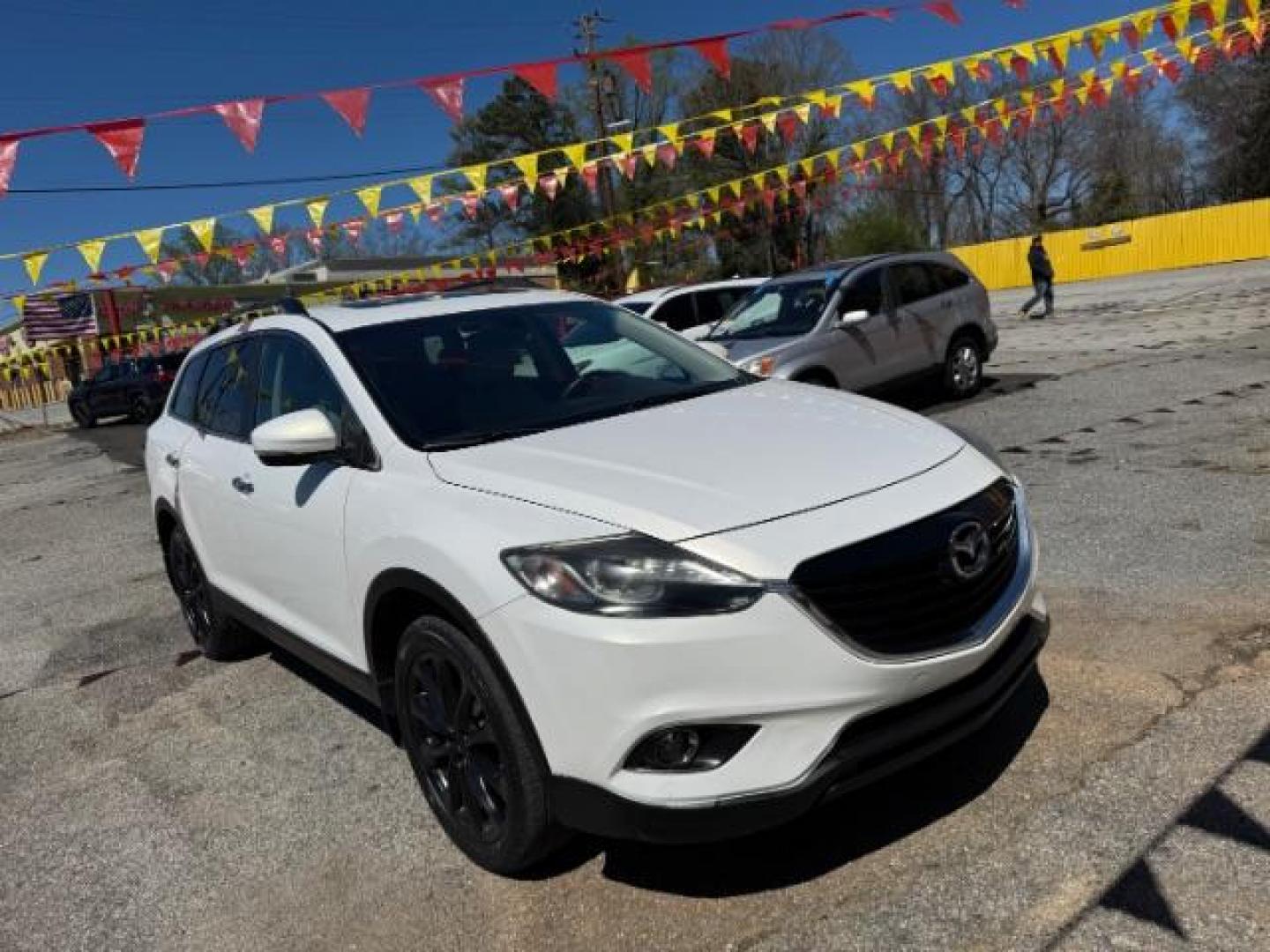 2014 White Mazda CX-9 Grand Touring (JM3TB2DA8E0) with an 3.7L V-6 DOHC engine, located at 1806 Veterans Memorial Hwy SW, Austell, GA, 30168, (770) 944-9558, 33.817959, -84.606987 - Photo#2