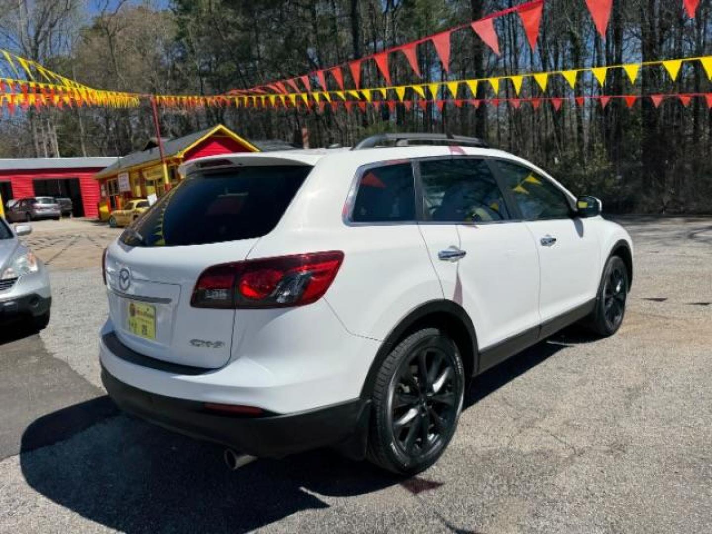 2014 White Mazda CX-9 Grand Touring (JM3TB2DA8E0) with an 3.7L V-6 DOHC engine, located at 1806 Veterans Memorial Hwy SW, Austell, GA, 30168, (770) 944-9558, 33.817959, -84.606987 - Photo#3