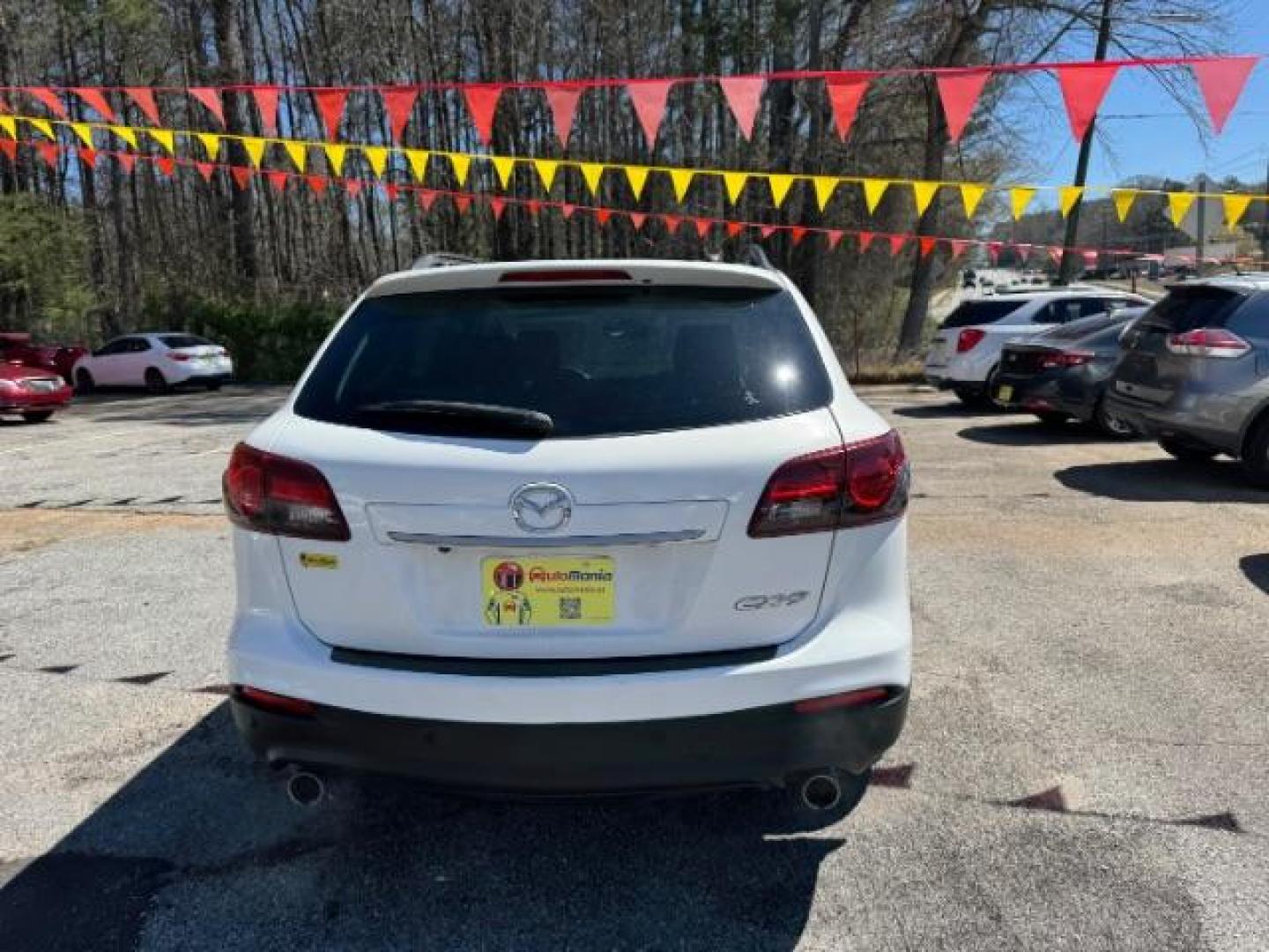 2014 White Mazda CX-9 Grand Touring (JM3TB2DA8E0) with an 3.7L V-6 DOHC engine, located at 1806 Veterans Memorial Hwy SW, Austell, GA, 30168, (770) 944-9558, 33.817959, -84.606987 - Photo#4
