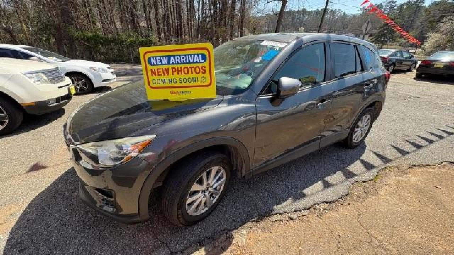2016 Gray Mazda CX-5 Touring (JM3KE2CY4G0) with an SKYACTIV-G 2.5L I-4 gasoline direct injection engine, located at 1806 Veterans Memorial Hwy SW, Austell, GA, 30168, (770) 944-9558, 33.817959, -84.606987 - Photo#0