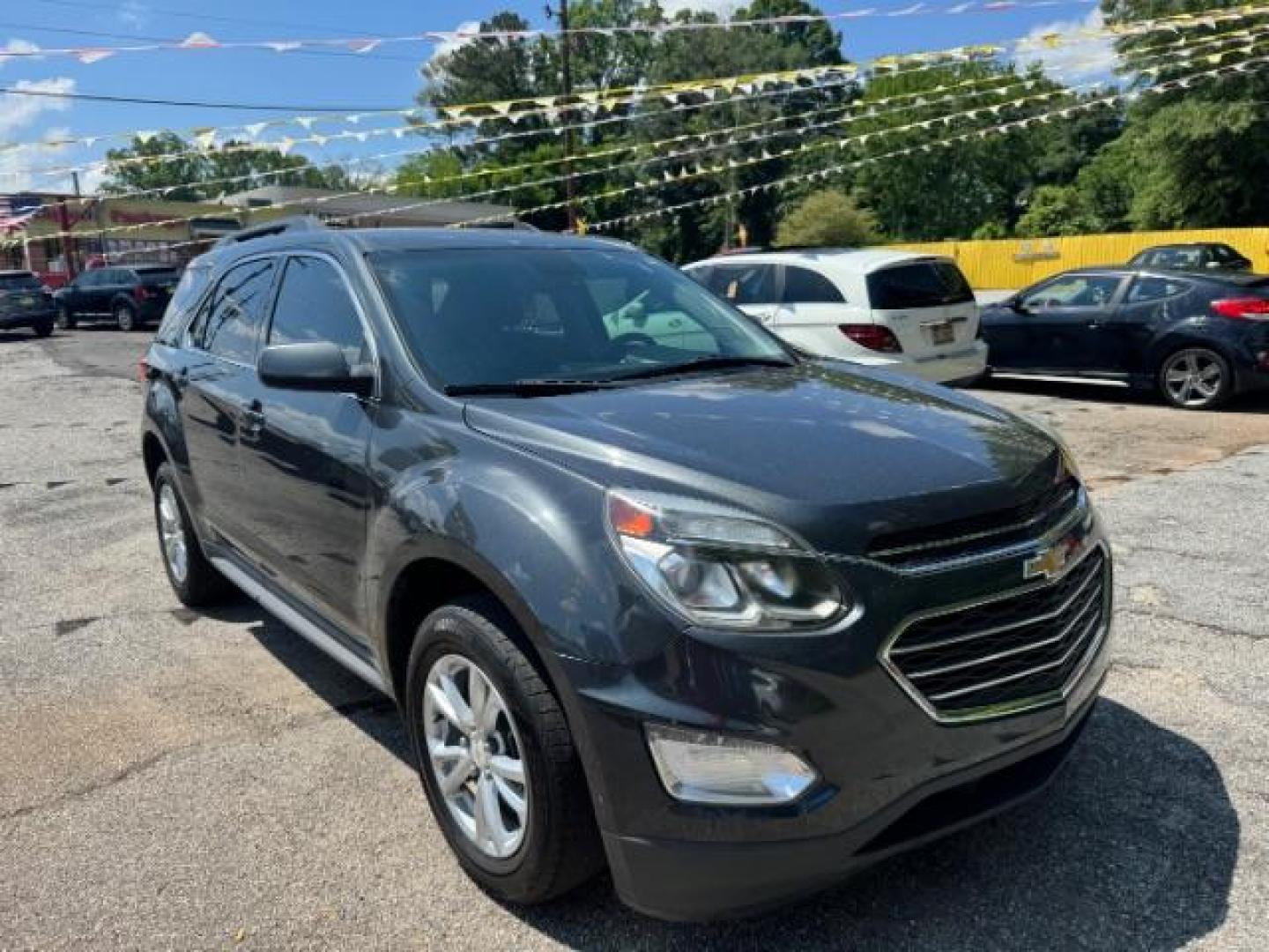 2017 Gray Chevrolet Equinox LT (2GNALCEK0H1) with an 2.4L I-4 gasoline direct injection engine, located at 1806 Veterans Memorial Hwy SW, Austell, GA, 30168, (770) 944-9558, 33.817959, -84.606987 - Photo#2