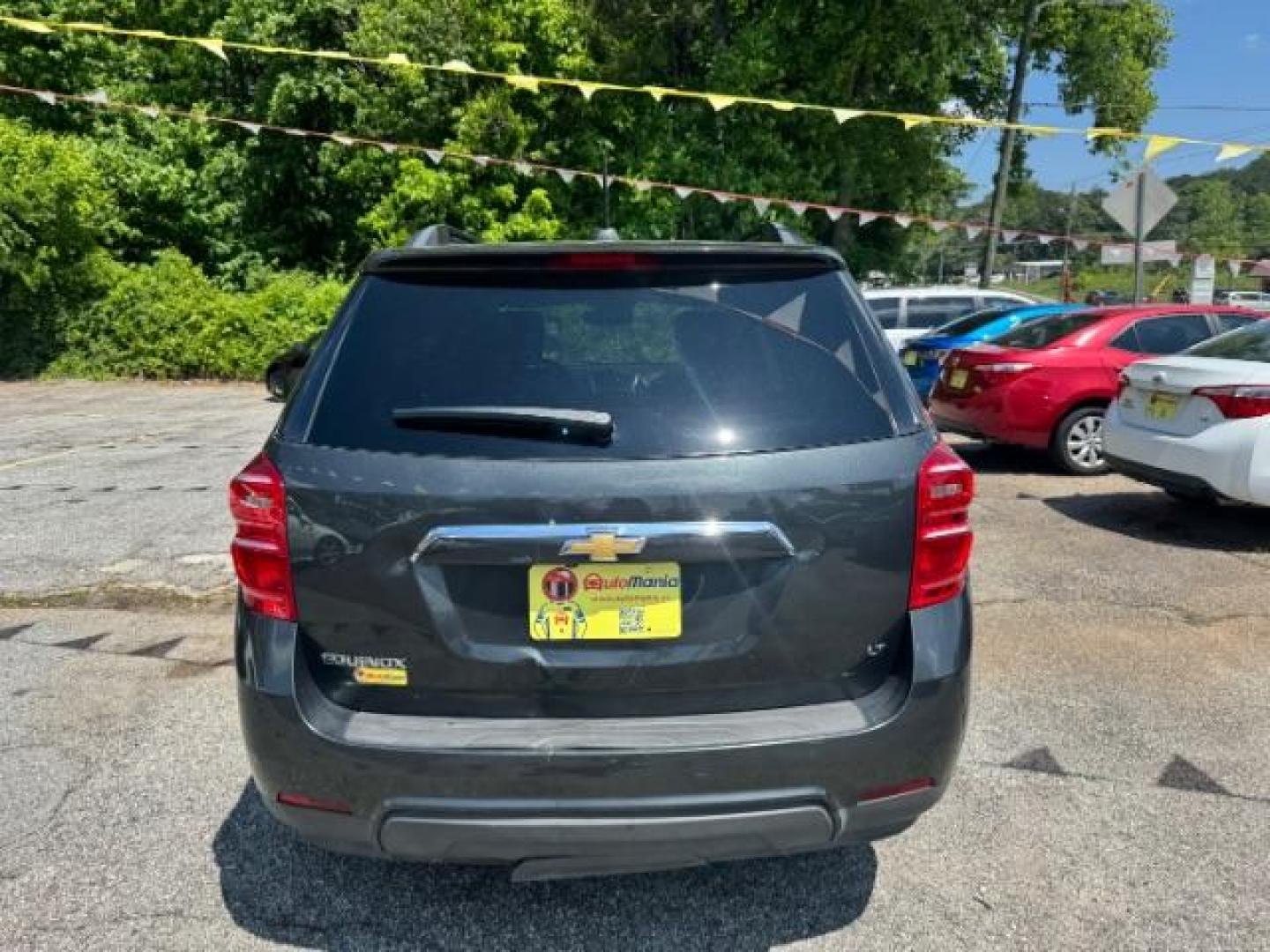 2017 Gray Chevrolet Equinox LT (2GNALCEK0H1) with an 2.4L I-4 gasoline direct injection engine, located at 1806 Veterans Memorial Hwy SW, Austell, GA, 30168, (770) 944-9558, 33.817959, -84.606987 - Photo#4