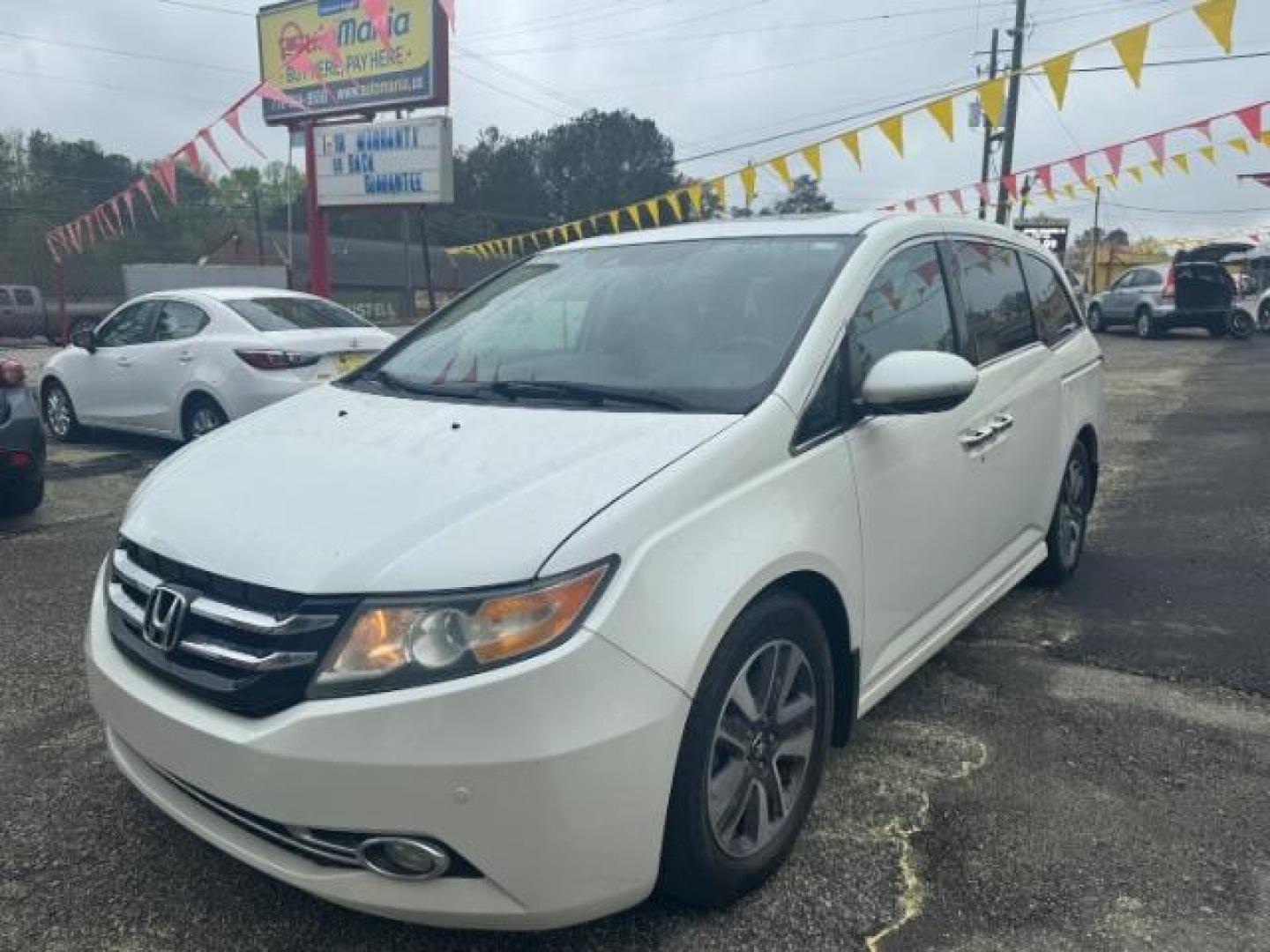 2014 White Honda Odyssey Touring | Touring Elite (5FNRL5H97EB) with an 3.5L V-6 i-VTEC variable valve control engine, located at 1806 Veterans Memorial Hwy SW, Austell, GA, 30168, (770) 944-9558, 33.817959, -84.606987 - Photo#0