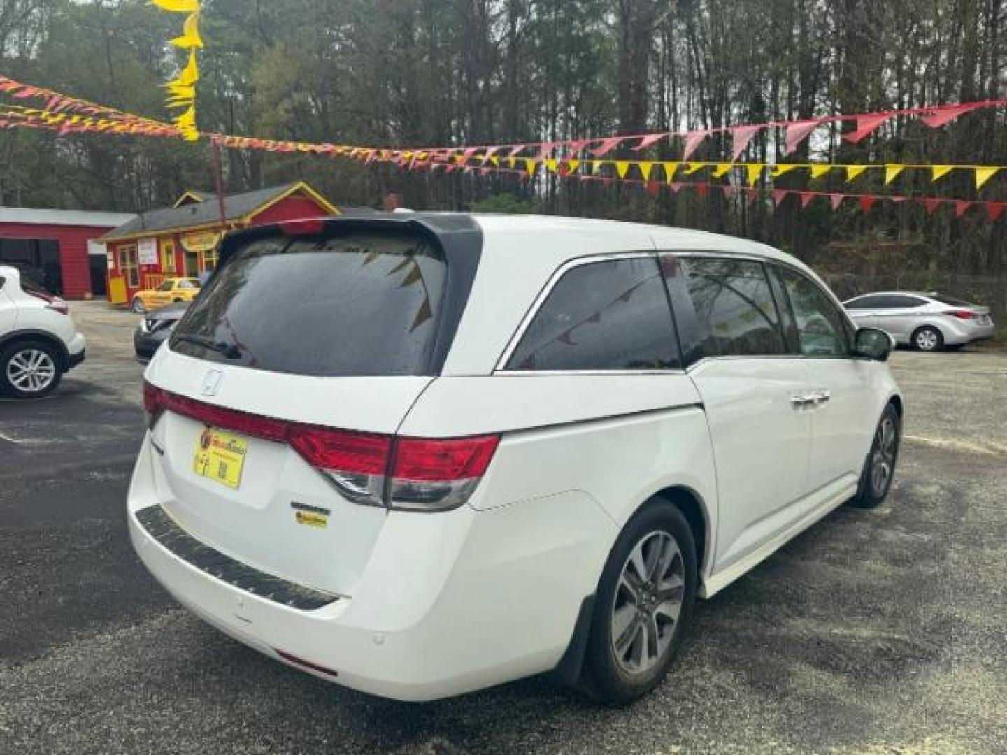 2014 White Honda Odyssey Touring | Touring Elite (5FNRL5H97EB) with an 3.5L V-6 i-VTEC variable valve control engine, located at 1806 Veterans Memorial Hwy SW, Austell, GA, 30168, (770) 944-9558, 33.817959, -84.606987 - Photo#2