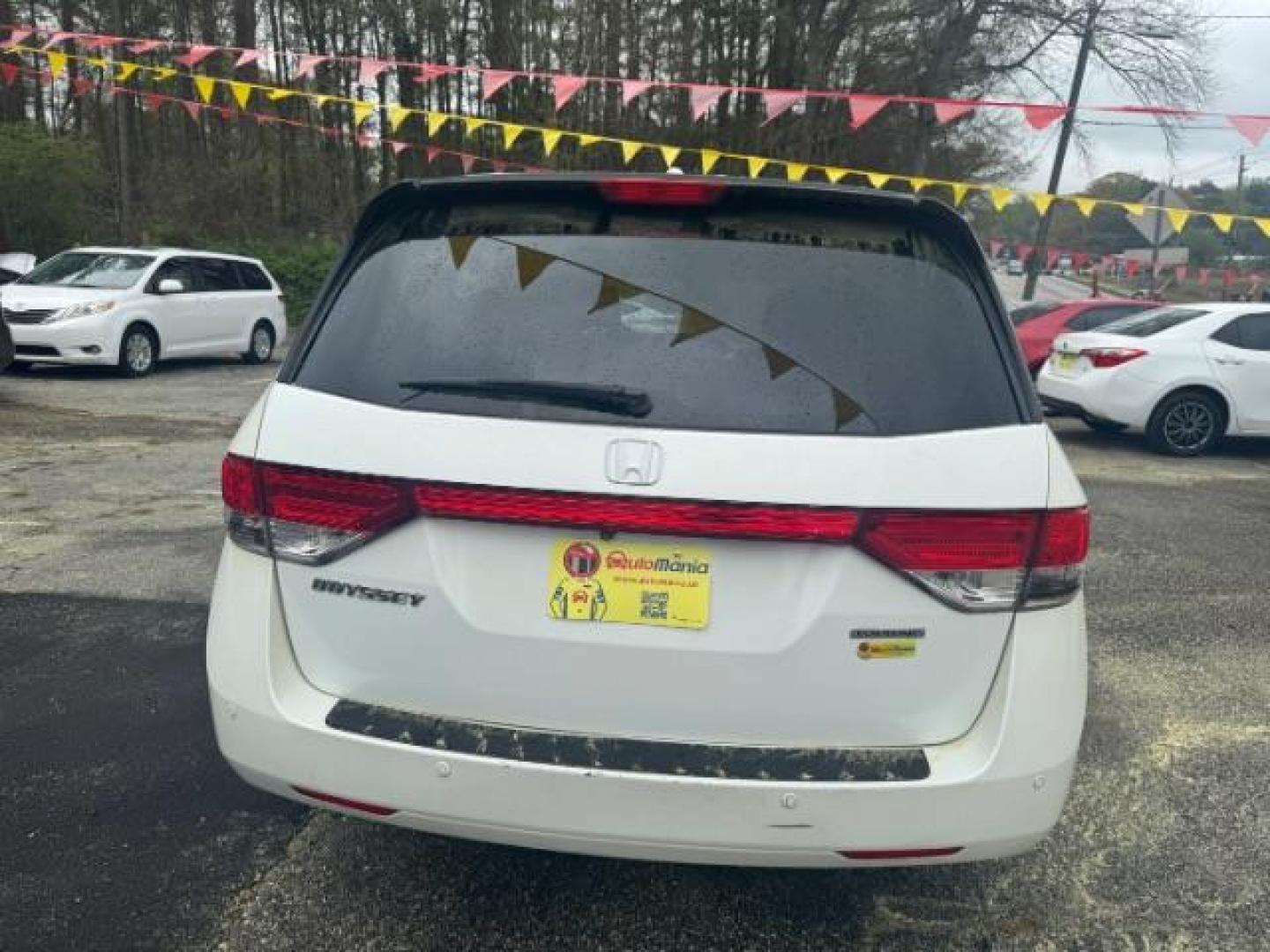 2014 White Honda Odyssey Touring | Touring Elite (5FNRL5H97EB) with an 3.5L V-6 i-VTEC variable valve control engine, located at 1806 Veterans Memorial Hwy SW, Austell, GA, 30168, (770) 944-9558, 33.817959, -84.606987 - Photo#4
