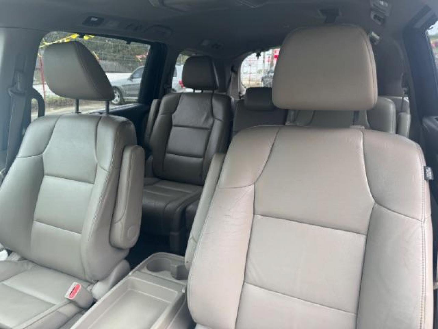 2014 White Honda Odyssey Touring | Touring Elite (5FNRL5H97EB) with an 3.5L V-6 i-VTEC variable valve control engine, located at 1806 Veterans Memorial Hwy SW, Austell, GA, 30168, (770) 944-9558, 33.817959, -84.606987 - Photo#7