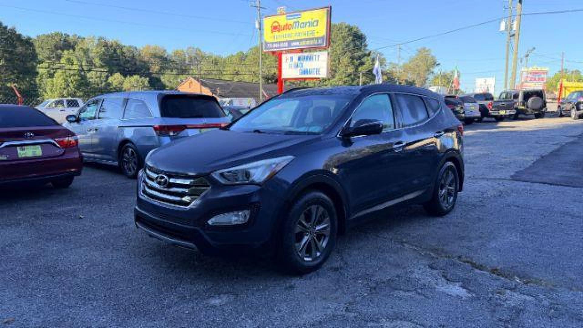 2014 Gray Hyundai Santa Fe Sport 2.4L (5XYZU3LB9EG) with an Theta II 2.4L I-4 ga engine, located at 1806 Veterans Memorial Hwy SW, Austell, GA, 30168, (770) 944-9558, 33.817959, -84.606987 - Photo#0