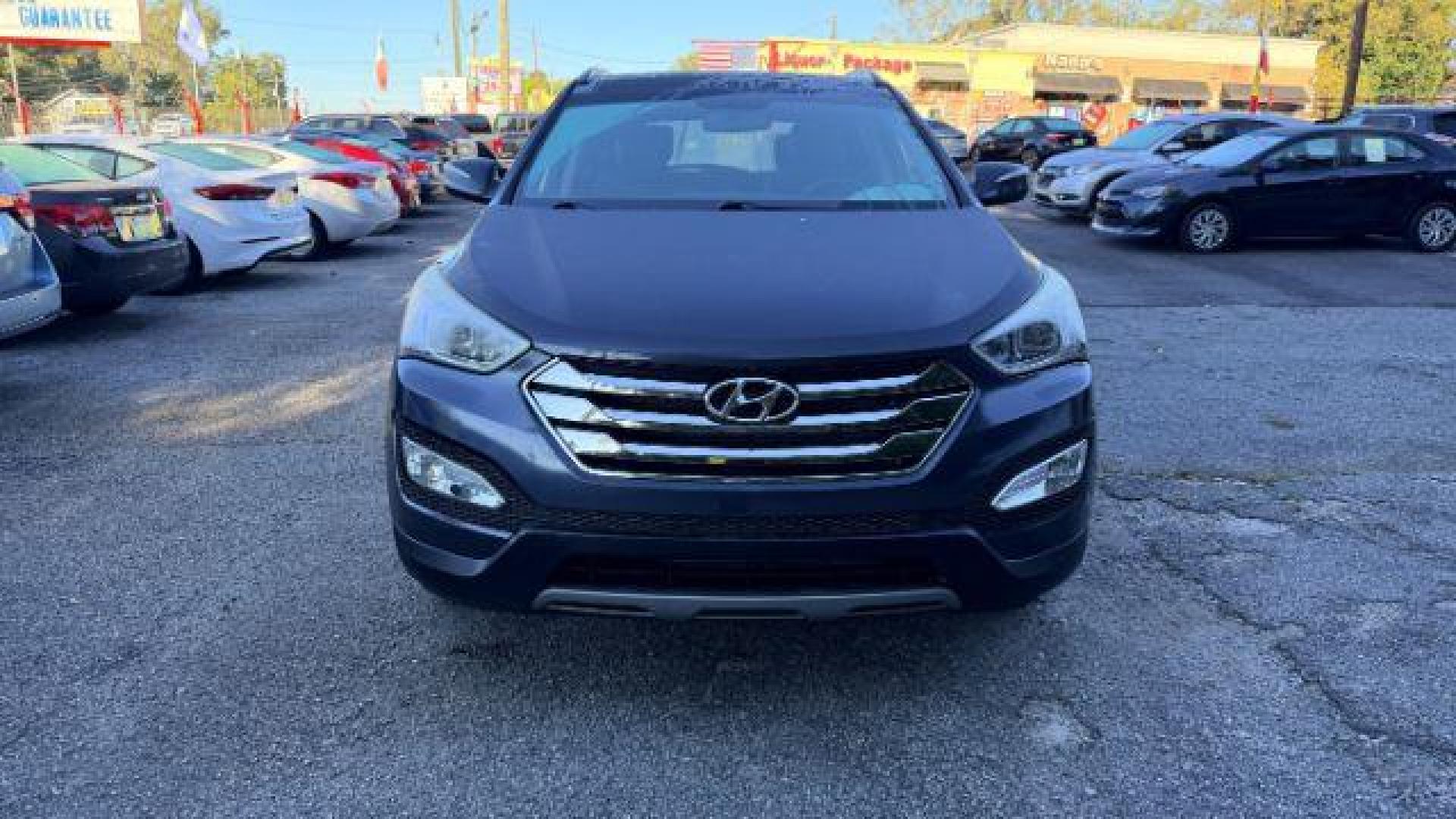 2014 Gray Hyundai Santa Fe Sport 2.4L (5XYZU3LB9EG) with an Theta II 2.4L I-4 ga engine, located at 1806 Veterans Memorial Hwy SW, Austell, GA, 30168, (770) 944-9558, 33.817959, -84.606987 - Photo#1