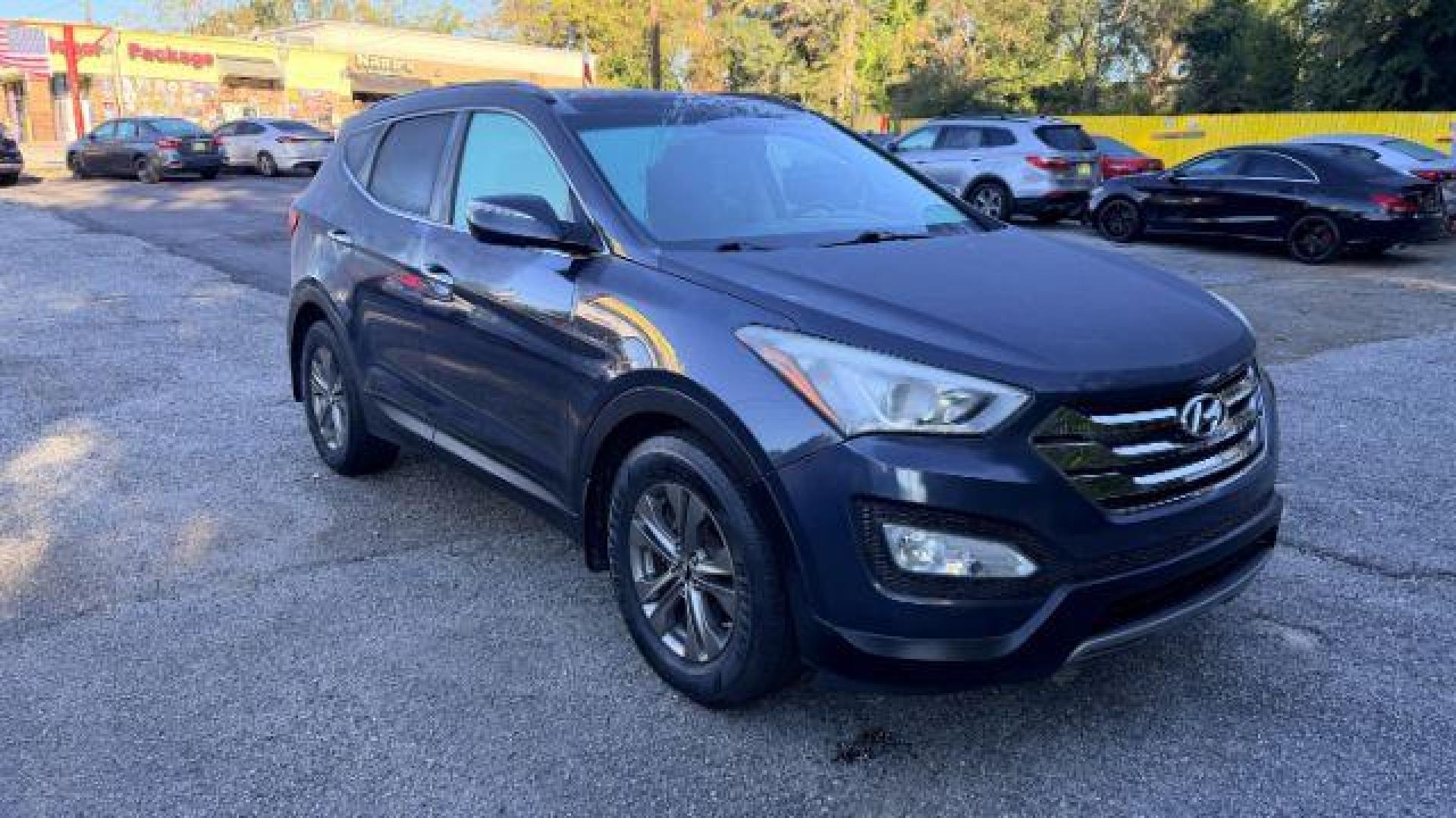 2014 Gray Hyundai Santa Fe Sport 2.4L (5XYZU3LB9EG) with an Theta II 2.4L I-4 ga engine, located at 1806 Veterans Memorial Hwy SW, Austell, GA, 30168, (770) 944-9558, 33.817959, -84.606987 - Photo#2