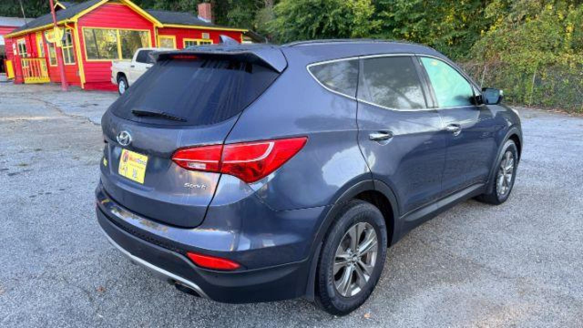 2014 Gray Hyundai Santa Fe Sport 2.4L (5XYZU3LB9EG) with an Theta II 2.4L I-4 ga engine, located at 1806 Veterans Memorial Hwy SW, Austell, GA, 30168, (770) 944-9558, 33.817959, -84.606987 - Photo#3
