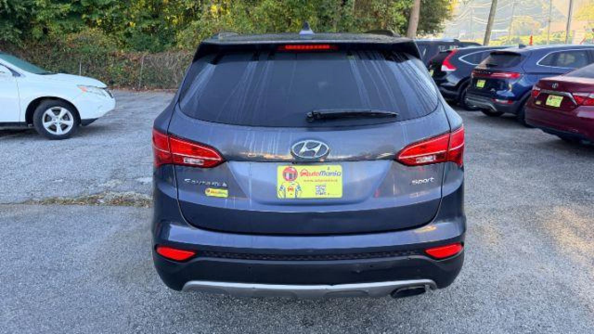 2014 Gray Hyundai Santa Fe Sport 2.4L (5XYZU3LB9EG) with an Theta II 2.4L I-4 ga engine, located at 1806 Veterans Memorial Hwy SW, Austell, GA, 30168, (770) 944-9558, 33.817959, -84.606987 - Photo#4