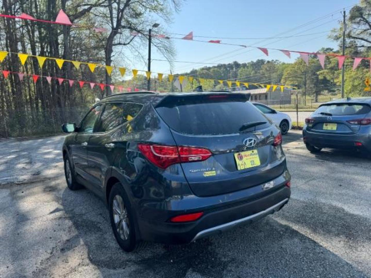 2014 Gray Hyundai Santa Fe Sport 2.4L (5XYZU3LB9EG) with an Theta II 2.4L I-4 gasoline direct injection engine, located at 1806 Veterans Memorial Hwy SW, Austell, GA, 30168, (770) 944-9558, 33.817959, -84.606987 - Photo#2