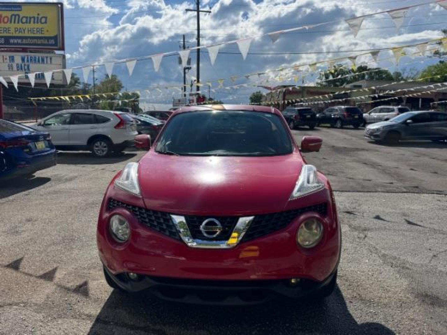 2015 Red Nissan Juke SV (JN8AF5MR5FT) with an 1.6L I-4 gasoline direct injection engine, located at 1806 Veterans Memorial Hwy SW, Austell, GA, 30168, (770) 944-9558, 33.817959, -84.606987 - Photo#1