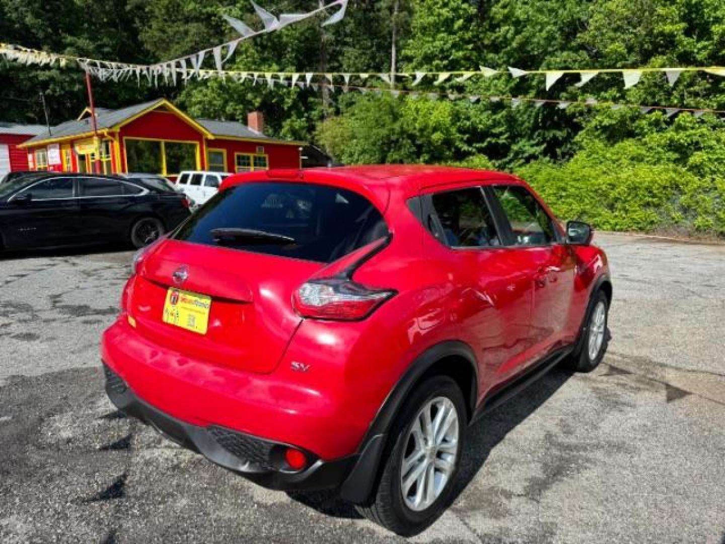2015 Red Nissan Juke SV (JN8AF5MR5FT) with an 1.6L I-4 gasoline direct injection engine, located at 1806 Veterans Memorial Hwy SW, Austell, GA, 30168, (770) 944-9558, 33.817959, -84.606987 - Photo#3