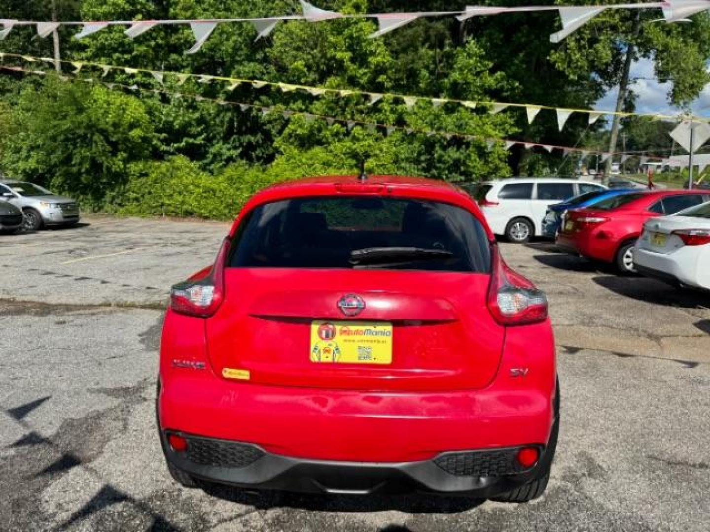 2015 Red Nissan Juke SV (JN8AF5MR5FT) with an 1.6L I-4 gasoline direct injection engine, located at 1806 Veterans Memorial Hwy SW, Austell, GA, 30168, (770) 944-9558, 33.817959, -84.606987 - Photo#4