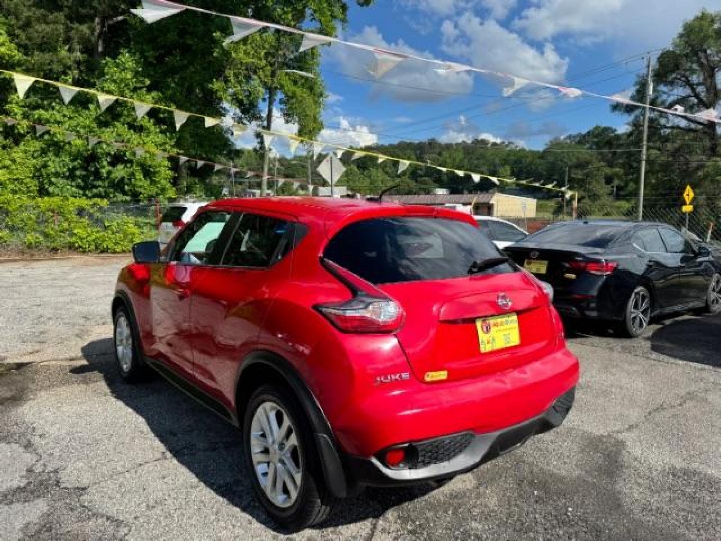 2015 Red Nissan Juke SV (JN8AF5MR5FT) with an 1.6L I-4 gasoline direct injection engine, located at 1806 Veterans Memorial Hwy SW, Austell, GA, 30168, (770) 944-9558, 33.817959, -84.606987 - Photo#5