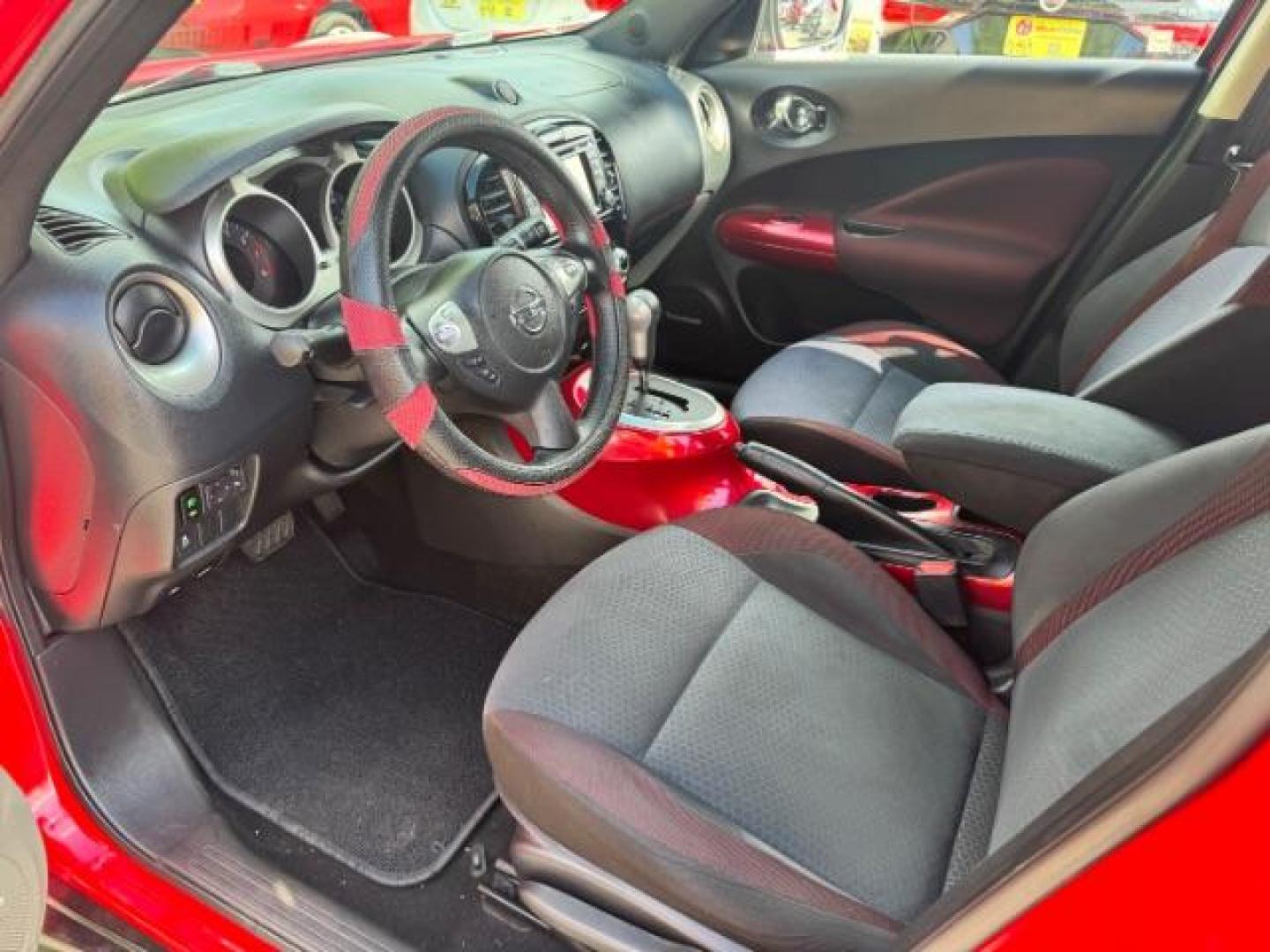 2015 Red Nissan Juke SV (JN8AF5MR5FT) with an 1.6L I-4 gasoline direct injection engine, located at 1806 Veterans Memorial Hwy SW, Austell, GA, 30168, (770) 944-9558, 33.817959, -84.606987 - Photo#6