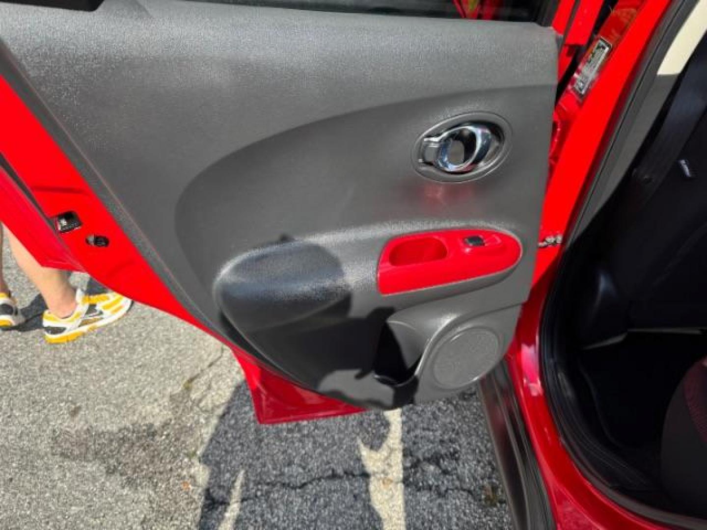 2015 Red Nissan Juke SV (JN8AF5MR5FT) with an 1.6L I-4 gasoline direct injection engine, located at 1806 Veterans Memorial Hwy SW, Austell, GA, 30168, (770) 944-9558, 33.817959, -84.606987 - Photo#9