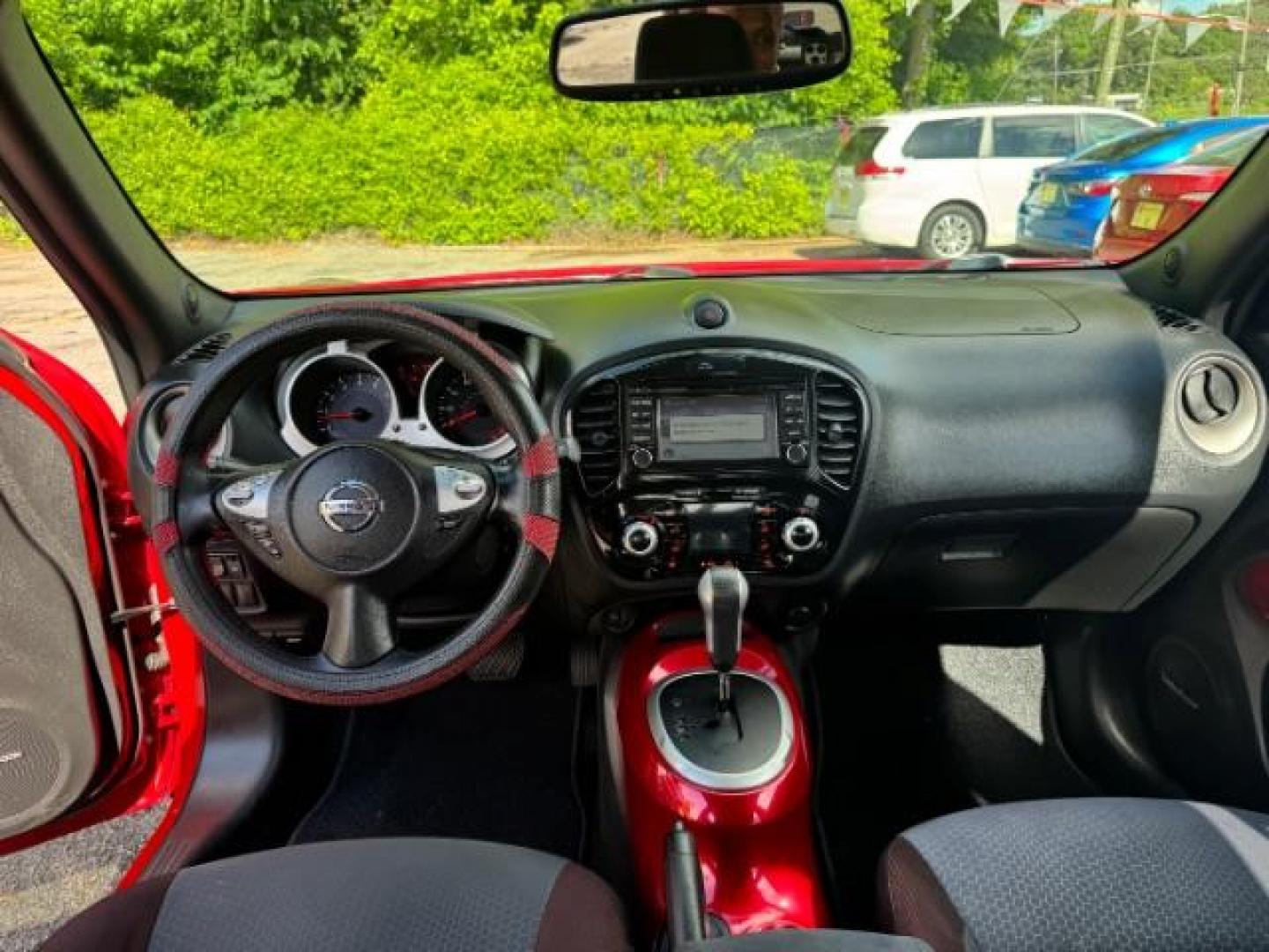 2015 Red Nissan Juke SV (JN8AF5MR5FT) with an 1.6L I-4 gasoline direct injection engine, located at 1806 Veterans Memorial Hwy SW, Austell, GA, 30168, (770) 944-9558, 33.817959, -84.606987 - Photo#10