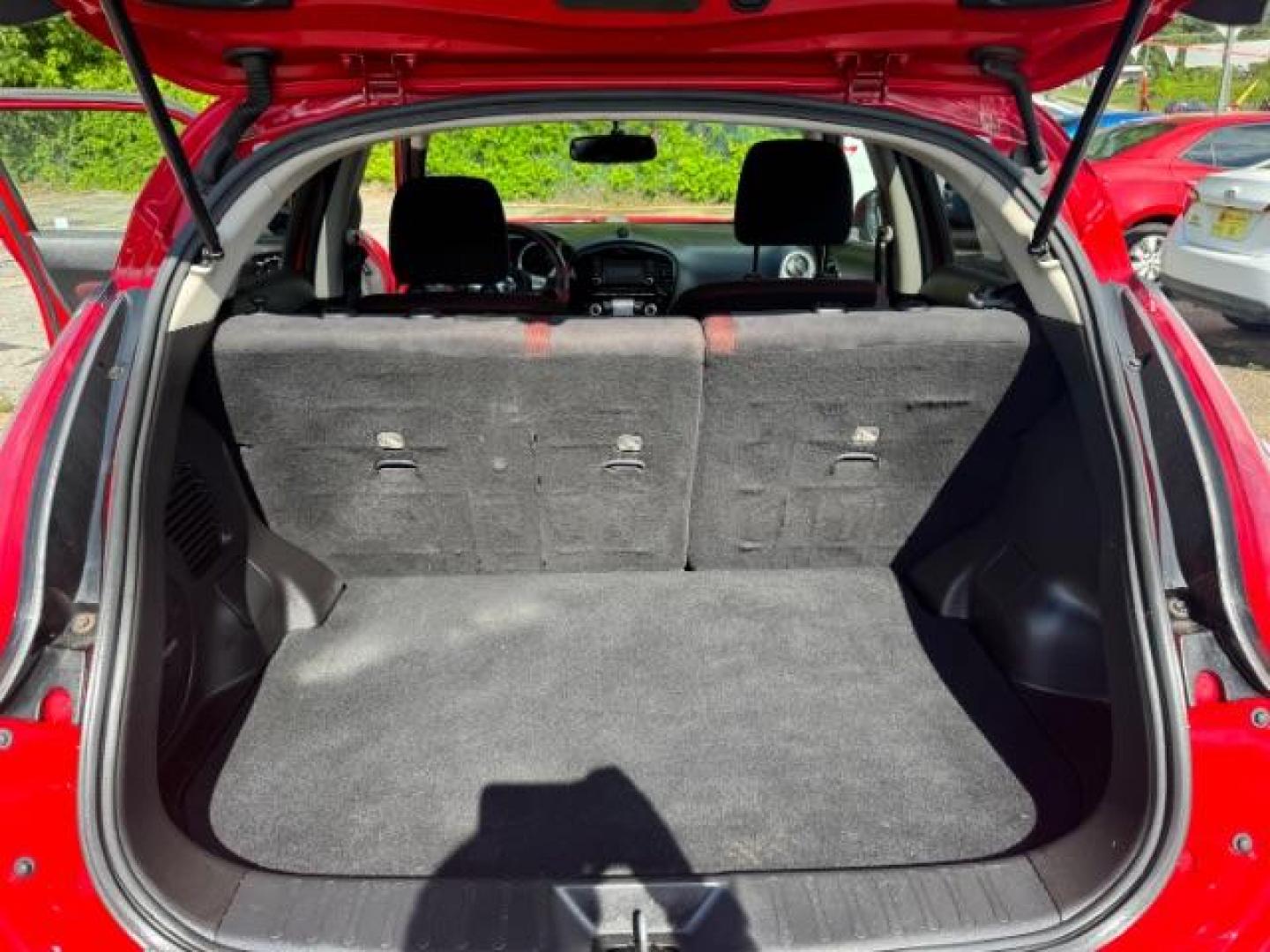 2015 Red Nissan Juke SV (JN8AF5MR5FT) with an 1.6L I-4 gasoline direct injection engine, located at 1806 Veterans Memorial Hwy SW, Austell, GA, 30168, (770) 944-9558, 33.817959, -84.606987 - Photo#11