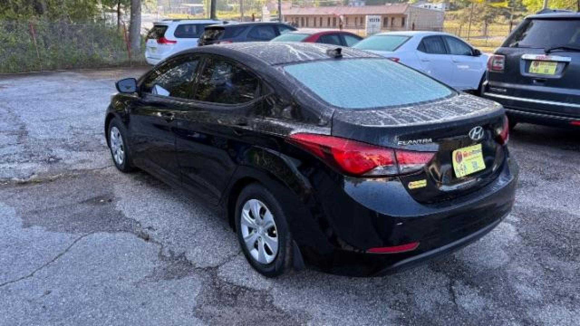 2016 Black Hyundai Elantra SE (5NPDH4AE5GH) with an Nu 1.8L I-4 DOHC engine, located at 1806 Veterans Memorial Hwy SW, Austell, GA, 30168, (770) 944-9558, 33.817959, -84.606987 - Photo#5