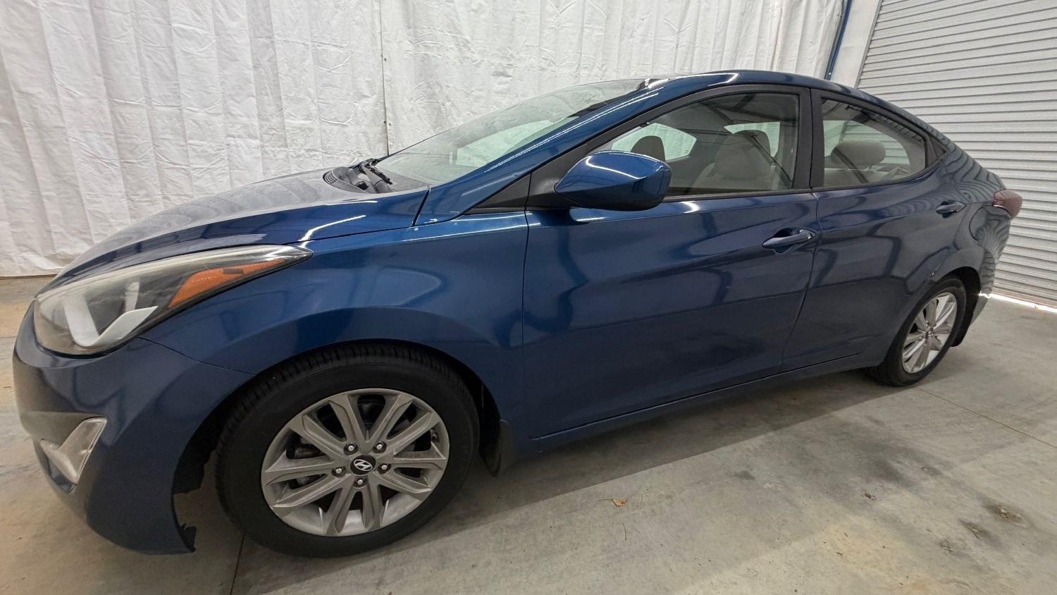 2015 Blue Hyundai Elantra SE (KMHDH4AE3FU) with an Nu 1.8L I-4 DOHC engine, located at 1806 Veterans Memorial Hwy SW, Austell, GA, 30168, (770) 944-9558, 33.817959, -84.606987- Photo#1