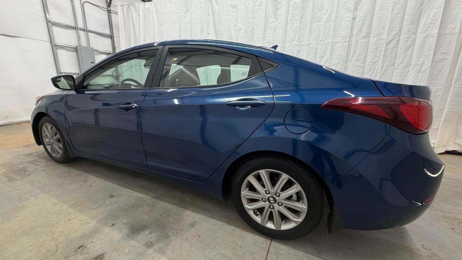 2015 Blue Hyundai Elantra SE (KMHDH4AE3FU) with an Nu 1.8L I-4 DOHC engine, located at 1806 Veterans Memorial Hwy SW, Austell, GA, 30168, (770) 944-9558, 33.817959, -84.606987- Photo#2