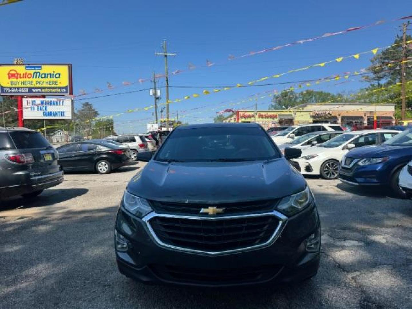 2018 Gray Chevrolet Equinox LS (3GNAXHEV0JS) with an 1.5L I-4 gasoline direct injection engine, located at 1806 Veterans Memorial Hwy SW, Austell, GA, 30168, (770) 944-9558, 33.817959, -84.606987 - Photo#0