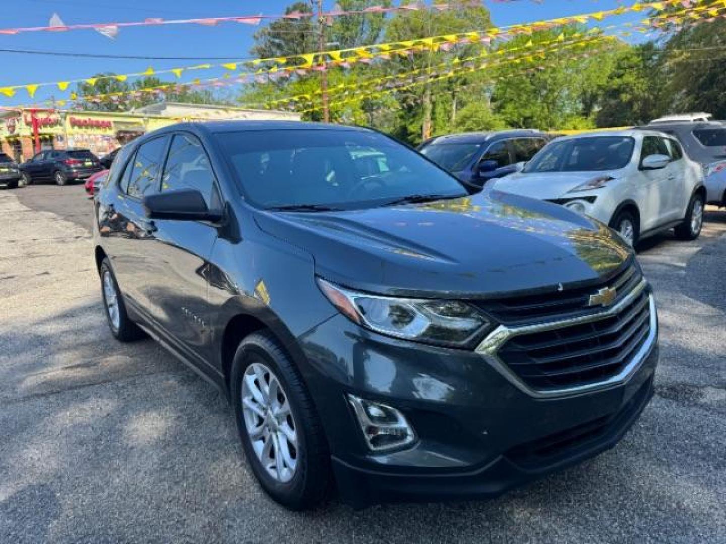 2018 Gray Chevrolet Equinox LS (3GNAXHEV0JS) with an 1.5L I-4 gasoline direct injection engine, located at 1806 Veterans Memorial Hwy SW, Austell, GA, 30168, (770) 944-9558, 33.817959, -84.606987 - Photo#2