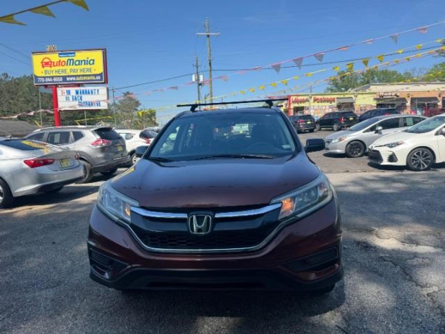 2015 Brown Honda CR-V LX (2HKRM3H39FH) with an 2.4L I-4 gasoline direct injection engine, located at 1806 Veterans Memorial Hwy SW, Austell, GA, 30168, (770) 944-9558, 33.817959, -84.606987 - Photo#1