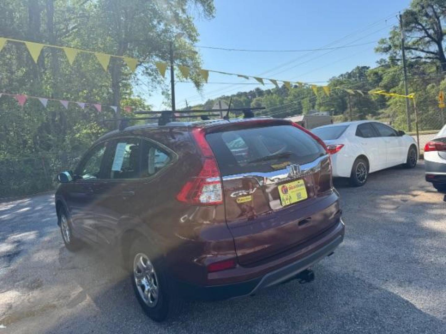 2015 Brown Honda CR-V LX (2HKRM3H39FH) with an 2.4L I-4 gasoline direct injection engine, located at 1806 Veterans Memorial Hwy SW, Austell, GA, 30168, (770) 944-9558, 33.817959, -84.606987 - Photo#5