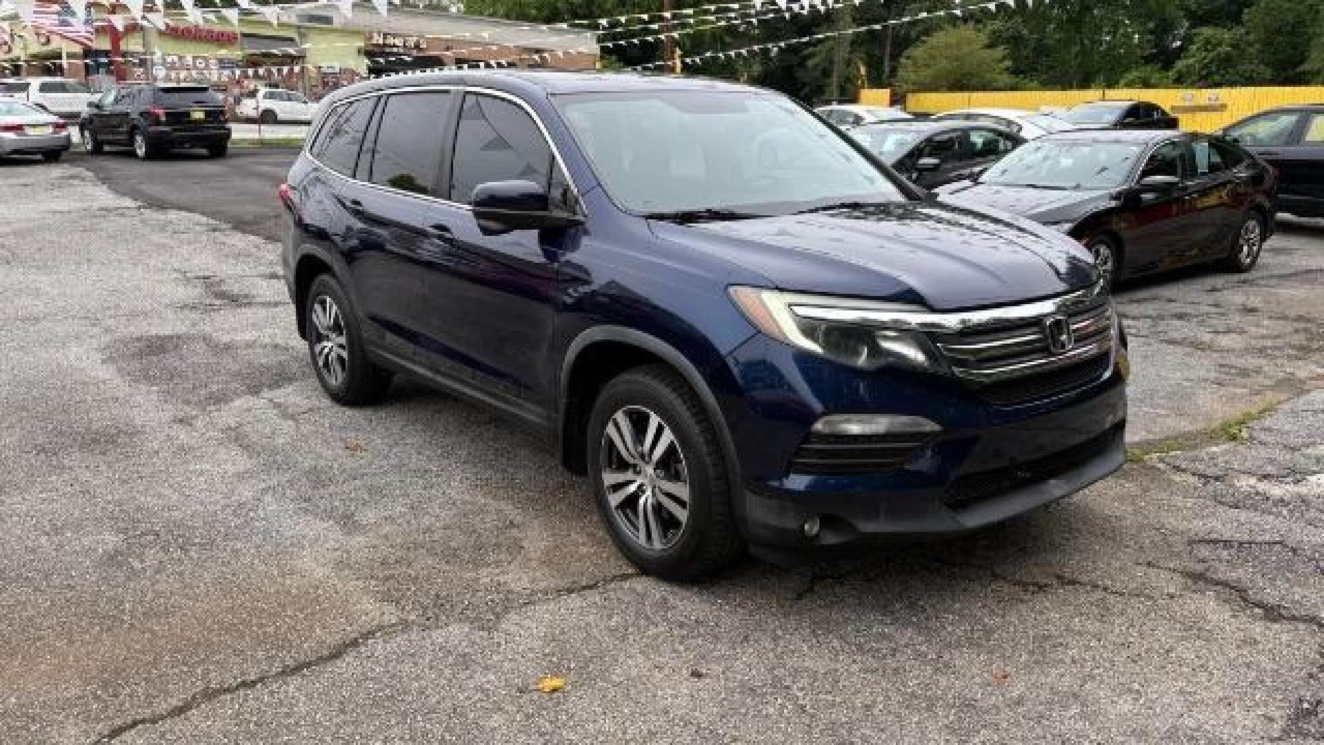 2016 Blue Honda Pilot EX (5FNYF5H3XGB) with an 3.5L V-6 gasoline direct injection engine, located at 1806 Veterans Memorial Hwy SW, Austell, GA, 30168, (770) 944-9558, 33.817959, -84.606987 - Photo#2