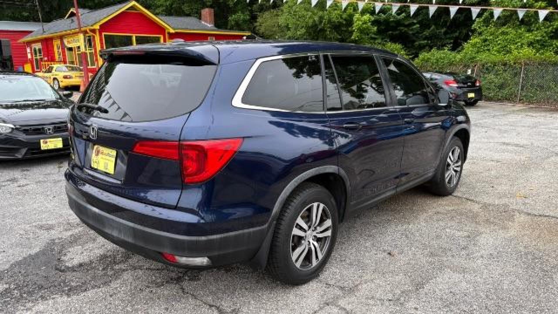 2016 Blue Honda Pilot EX (5FNYF5H3XGB) with an 3.5L V-6 gasoline direct injection engine, located at 1806 Veterans Memorial Hwy SW, Austell, GA, 30168, (770) 944-9558, 33.817959, -84.606987 - Photo#3
