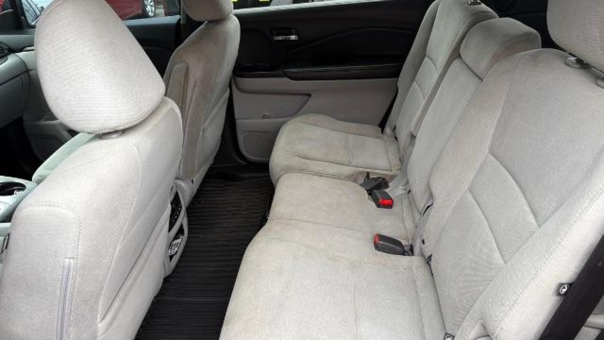 2016 Blue Honda Pilot EX (5FNYF5H3XGB) with an 3.5L V-6 gasoline direct injection engine, located at 1806 Veterans Memorial Hwy SW, Austell, GA, 30168, (770) 944-9558, 33.817959, -84.606987 - Photo#6