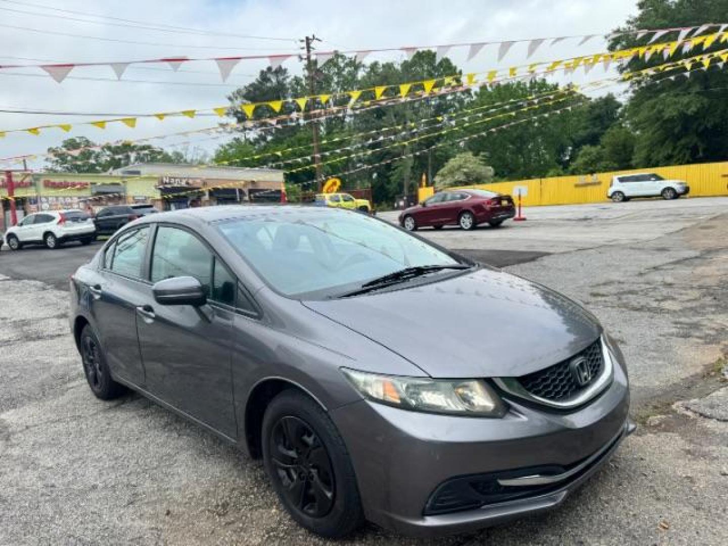 2015 Gray Honda Civic LX (19XFB2F57FE) with an 1.8L I-4 i-VTEC variable valve control engine, located at 1806 Veterans Memorial Hwy SW, Austell, GA, 30168, (770) 944-9558, 33.817959, -84.606987 - Photo#2