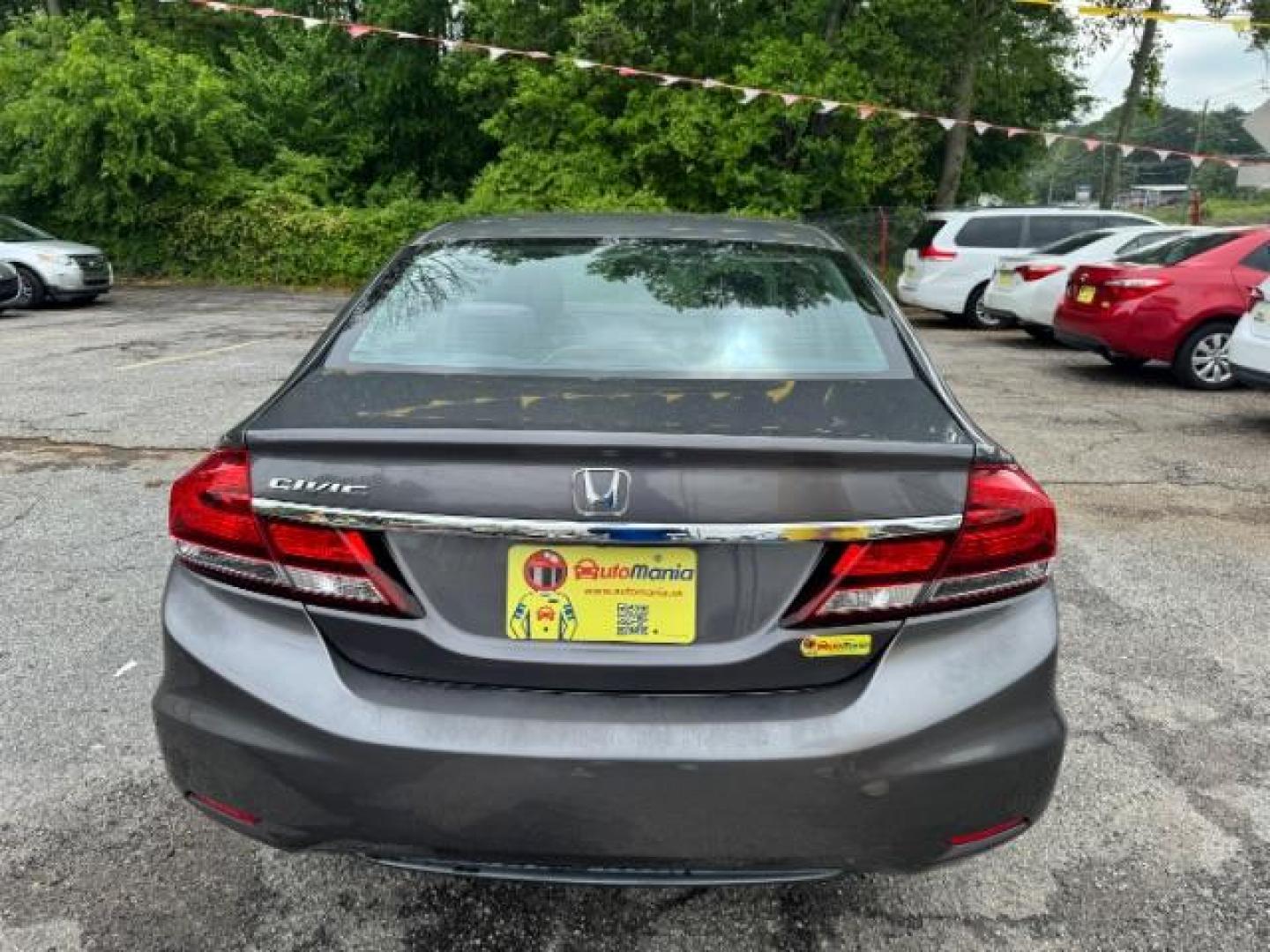 2015 Gray Honda Civic LX (19XFB2F57FE) with an 1.8L I-4 i-VTEC variable valve control engine, located at 1806 Veterans Memorial Hwy SW, Austell, GA, 30168, (770) 944-9558, 33.817959, -84.606987 - Photo#4