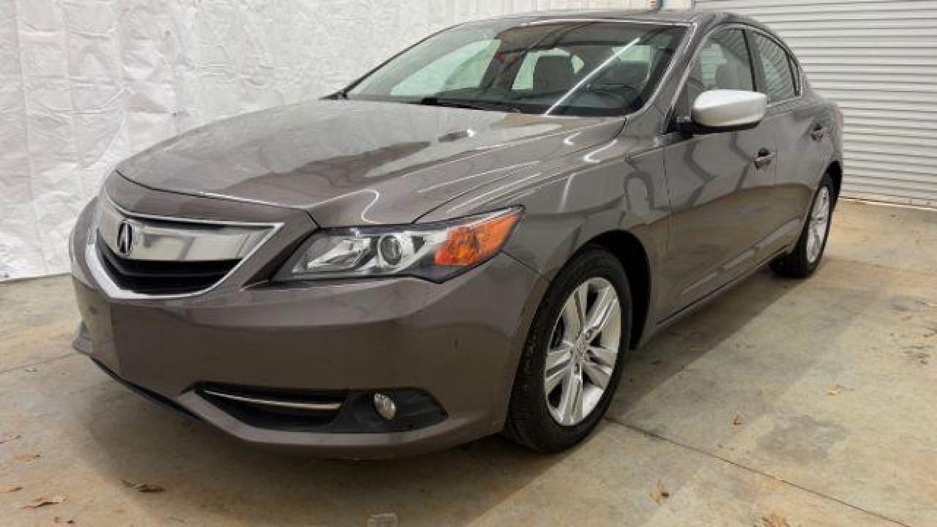 2013 Gray Acura ILX Hybrid 1.5L (19VDE3F7XDE) with an 1.5L I-4 i-VTEC variable valve control engine, located at 1806 Veterans Memorial Hwy SW, Austell, GA, 30168, (770) 944-9558, 33.817959, -84.606987 - Photo#0